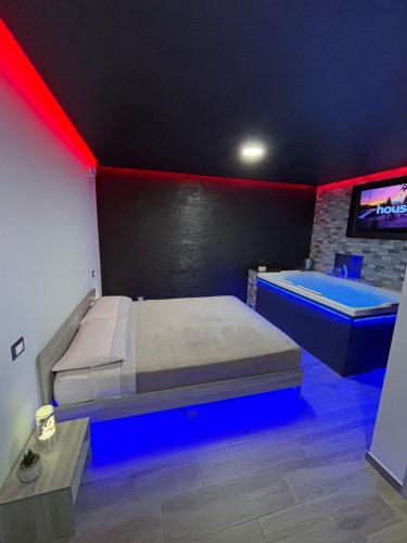 a bedroom with a bed and a tub in it at Fifty shades in Bisaccia