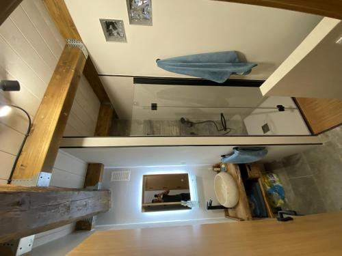 an attic room with stairs and a mirror at Ático en Jaca in Jaca