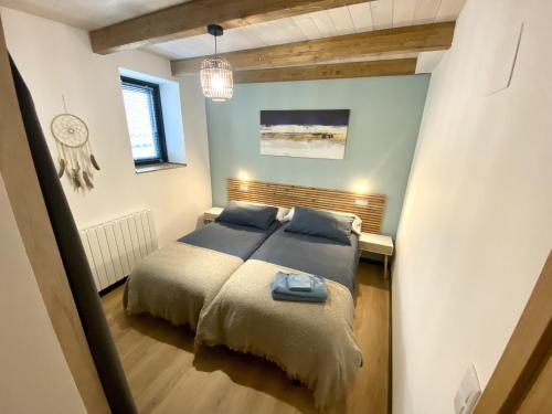a bedroom with two beds in a room at Ático en Jaca in Jaca