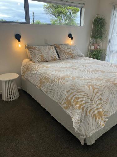 a large bed in a bedroom with a window at Cozy, Modern, Quiet House in Westport