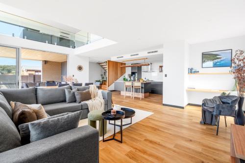a living room with a couch and a table at The Lookout, Albany Holiday House in Albany