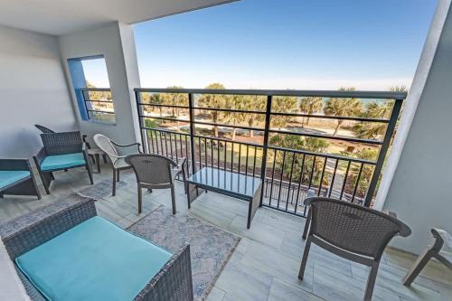 a balcony with tables and chairs and a view at 2BR Pools, Direct Oceanfront Views, Handicap, Nice in Myrtle Beach