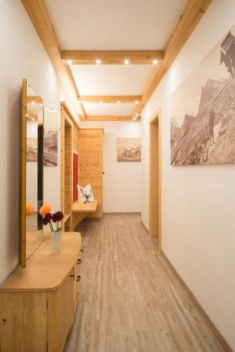 a hallway of a room with a vanity and a mirror at Fernblick in Mayrhofen