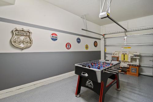 a room with a table in the middle of a garage at Four Bedrooms Resort TownHome 5128 in Kissimmee