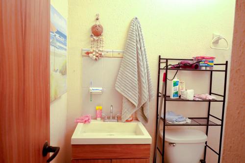 a bathroom with a sink and a toilet at Entire accommodation in Bahia de la Paz in La Paz