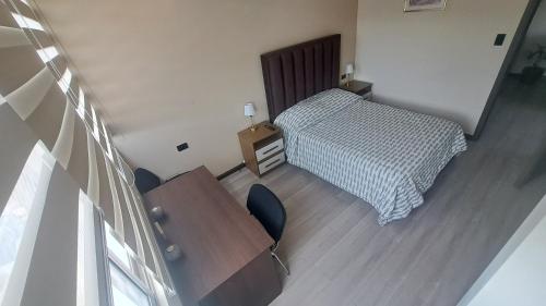 En eller flere senge i et værelse på Edificio HS TOWER - Piso 8 - Apartamento A