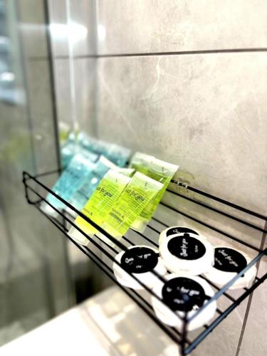 a glass shelf in a refrigerator with some items at Luxury home Cheshunt in Wormley