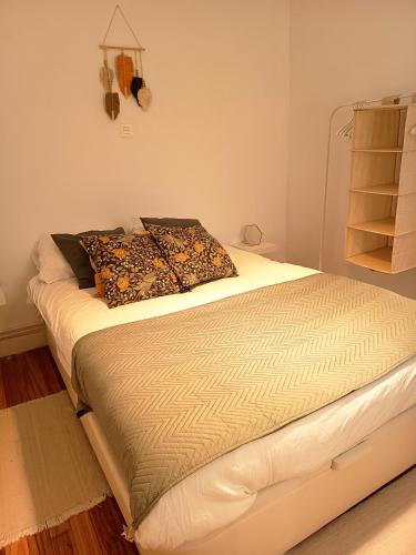 a large bed in a room with at SWEET HOME BILBAO in Bilbao
