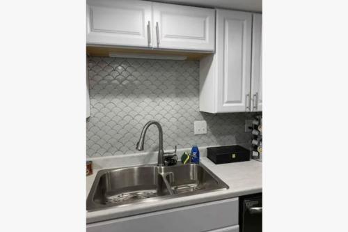 a kitchen with white cabinets and a sink at 3Bed 2Bath PRIVATE HOME Decatur in Decatur