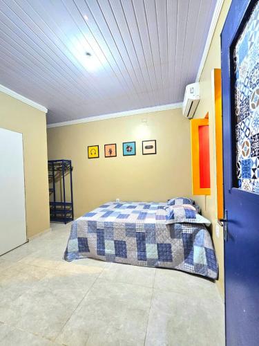 a bedroom with a bed in a room at Hostel do Seu Tico in São Luís