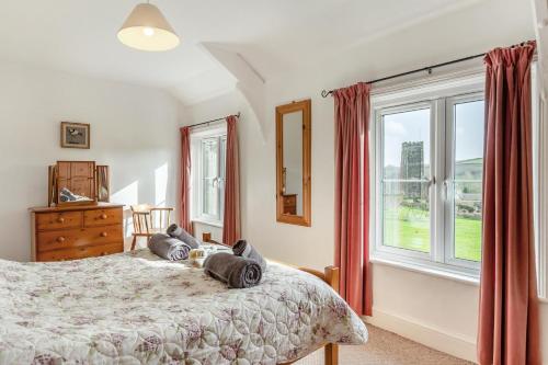 a bedroom with a bed and a large window at 4 Bed in Stokenham oc-i34021 in Stokenham