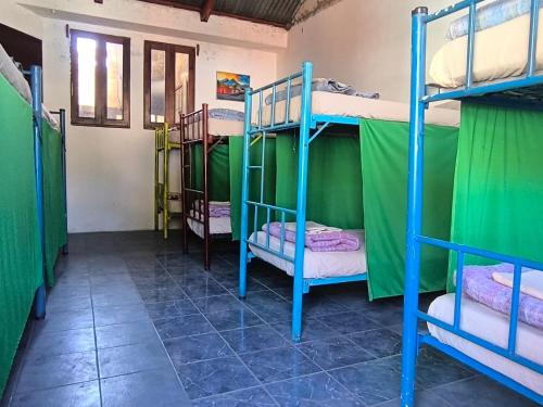 En eller flere senger på et rom på Karim Hostal Antigua