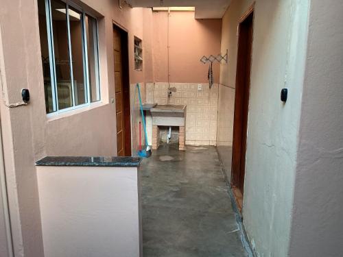 a bathroom with a sink in a room at Casa Tapajos in Ubatuba