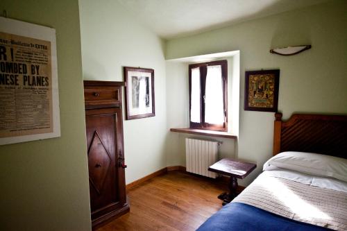 Postel nebo postele na pokoji v ubytování Agriturismo Il Passeggere
