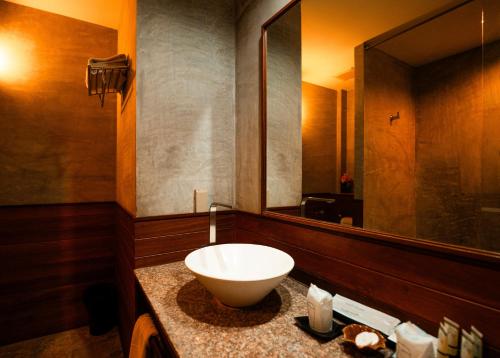 a bathroom with a sink and a large mirror at Ma Villa Khao Yai in Mu Si