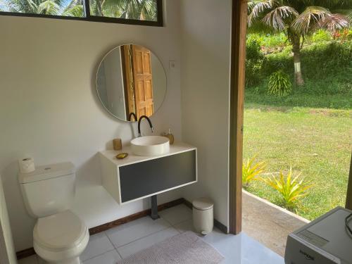 a bathroom with a sink and a mirror at Havaii Spot Huahine in HUH