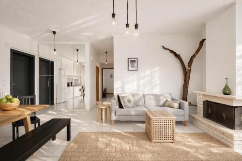 a living room with a couch and a fireplace at 3BR Suite 300mts from the Beach in Perea