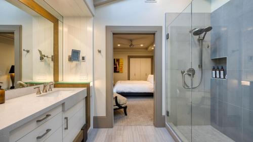 a bathroom with a sink and a shower and a bed at Devi Ranch by AvantStay in Paso Robles
