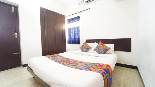 a bedroom with two beds in a room at Peelamedu PSG Tech Near Rooms in Coimbatore