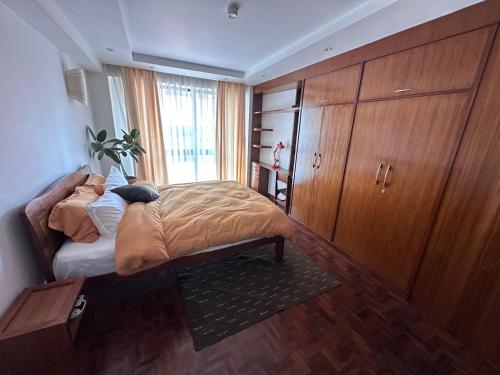 Llit o llits en una habitació de Sattya Apartment