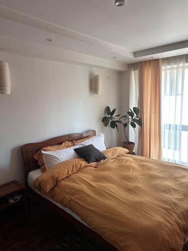Postel nebo postele na pokoji v ubytování Sattya Apartment