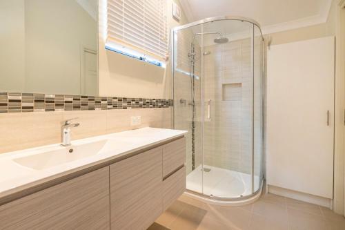 a bathroom with a sink and a shower at Sea Forth on Otter in Quindalup