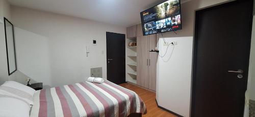 Postel nebo postele na pokoji v ubytování Mini Loft Deluxe