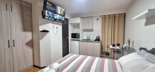 Kuchyň nebo kuchyňský kout v ubytování Mini Loft Deluxe
