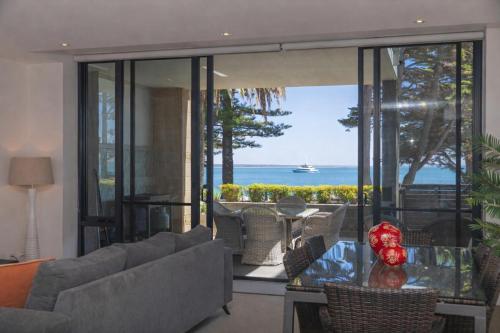 a living room with a view of the ocean at C-Scape water front apartment in Cowes