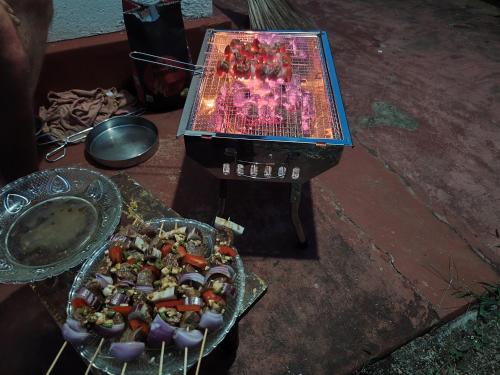 a video game on a screen next to a plate of food at Villa iSoNet in Weligama