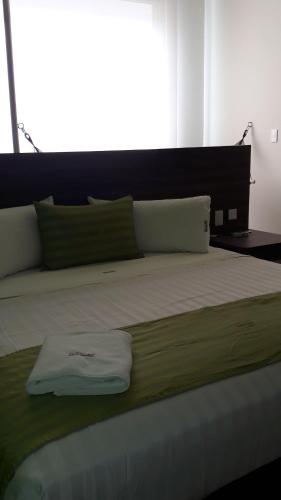 Katil atau katil-katil dalam bilik di Hotel y Villas Natura