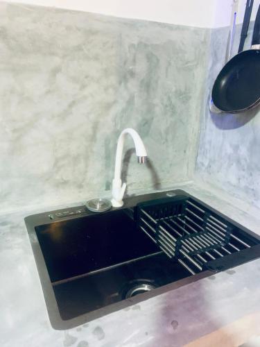 a kitchen sink with a faucet next to a sink at Frida Cove in Weligama