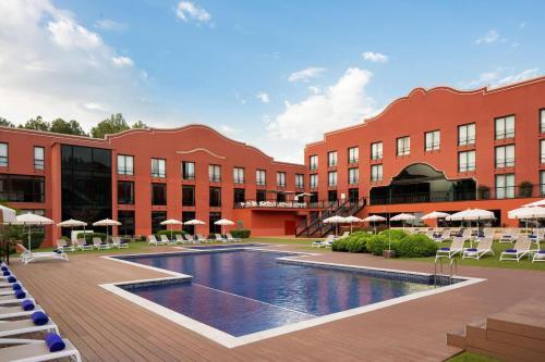 a rendering of a hotel with a swimming pool at Dolce by Wyndham Barcelona Resort 4 Sup in Sant Esteve Sesrovires