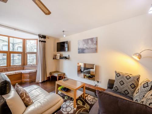 a living room with a couch and a table at The Drovers Rest - Uk43567 in Haltwhistle