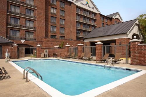 a large swimming pool in front of a hotel at Hyatt Place Sterling Dulles Airport North in Sterling