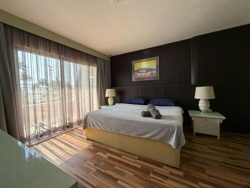 a bedroom with a bed with a teddy bear on it at The Regency PortDickson A1-7 in Port Dickson