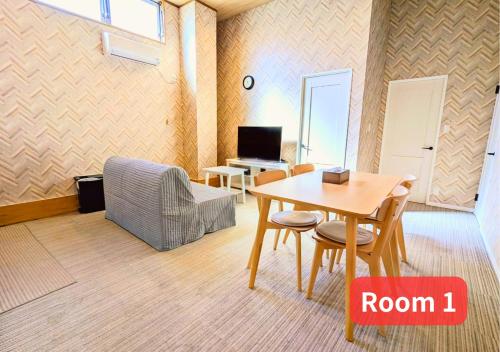 a room with a table and chairs and a room with a desk at MORIHIRO Building in Ichikawa