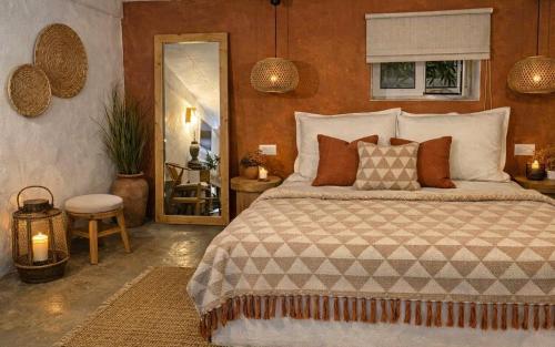 a bedroom with a large bed and a window at Katoi traditional house in Éxo Khóra