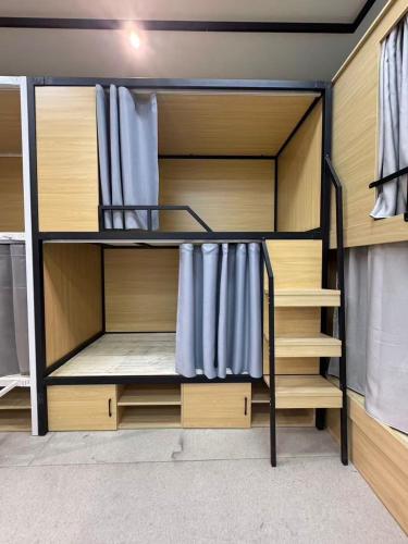 a bunk bed in a room with at Hostel Samui in Nathon Bay