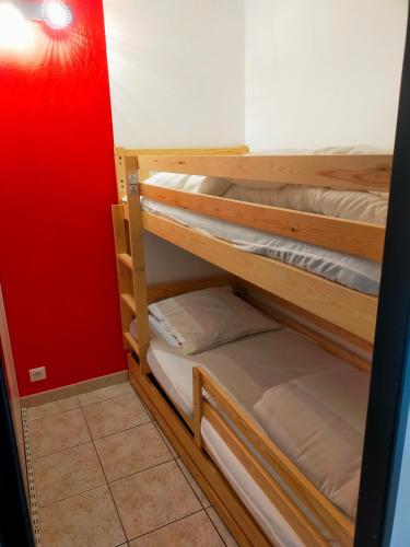 a room with wooden bunk beds in a room at Houlgate T2 bis in Houlgate