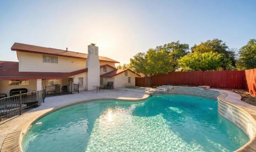 a swimming pool in the backyard of a house at Spacious 4BR with Private Pool, Near Six Flags in San Antonio
