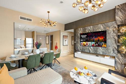 a living room with a dining table and a fireplace at Desert Key - Perfectly Located Yas Island Apartments in Abu Dhabi