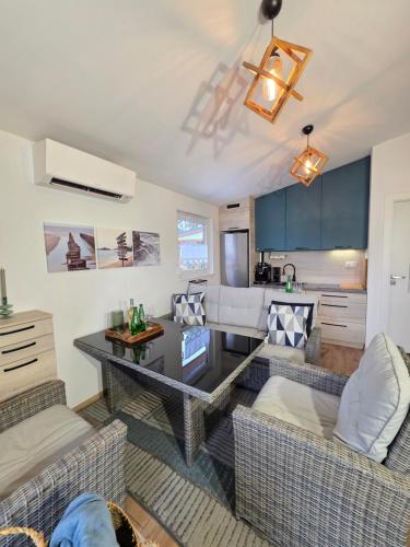 a living room with a couch and a table at Apartamenty Boszkowo Lakeside in Boszkowo