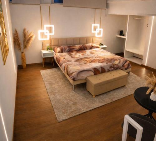 a bedroom with a large bed with lights above it at Italo House in Opera
