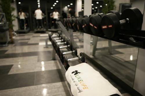 a row of dumbbells on a rack in a store at RYS Hotel in Edirne