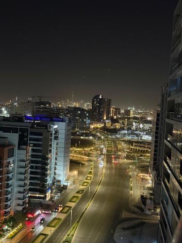 a city skyline at night with traffic on a street at TOP VIEW Luxury 2 bedrooms in Dubai only families in Dubai