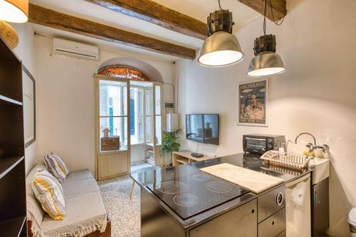 a kitchen with a large island in a room at Archbishop Street Valletta Apartment in Valletta