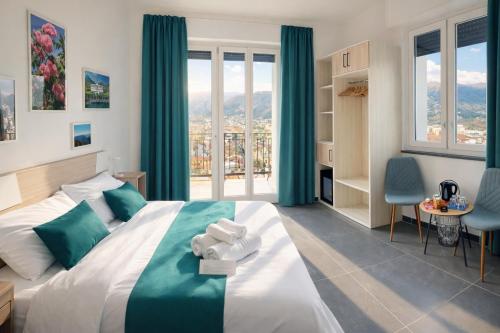 a bedroom with a large bed with blue curtains at Il Sogno in Como