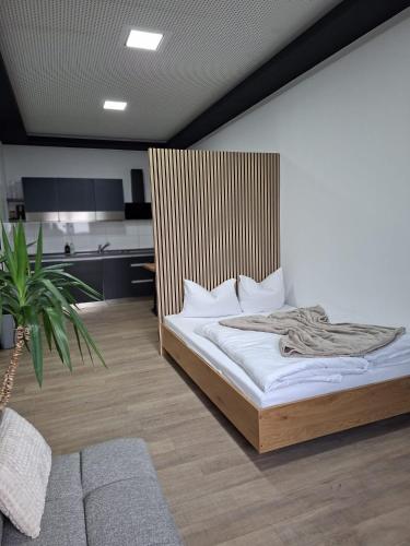 เตียงในห้องที่ Hotel Appartements asado