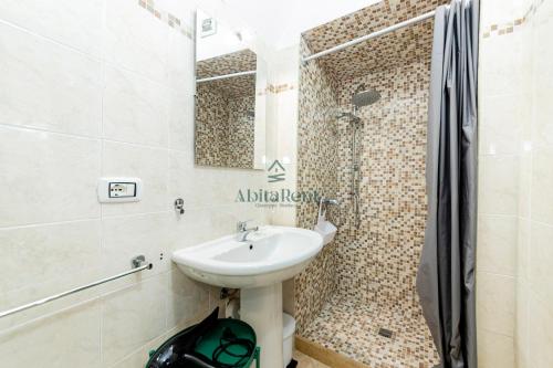 a bathroom with a sink and a shower at Casa di Levante - Gallipoli in Gallipoli